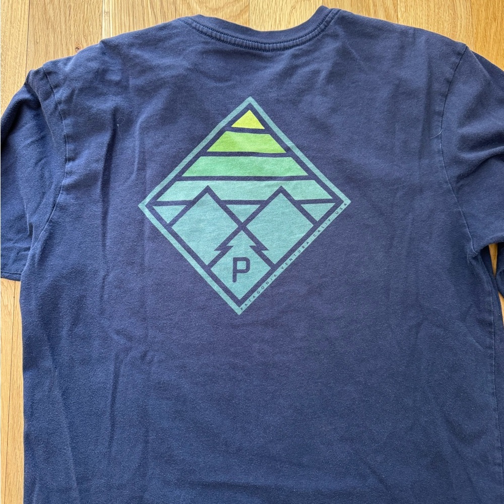 Patagonia men’s graphic Long T. Small pin holes on front.